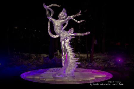 Rhonda Konicki/Ice Alaska a large lighted ice sculpture of a dancer outdoors