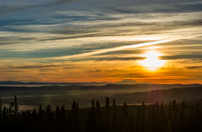 Solstice - sun over mountains