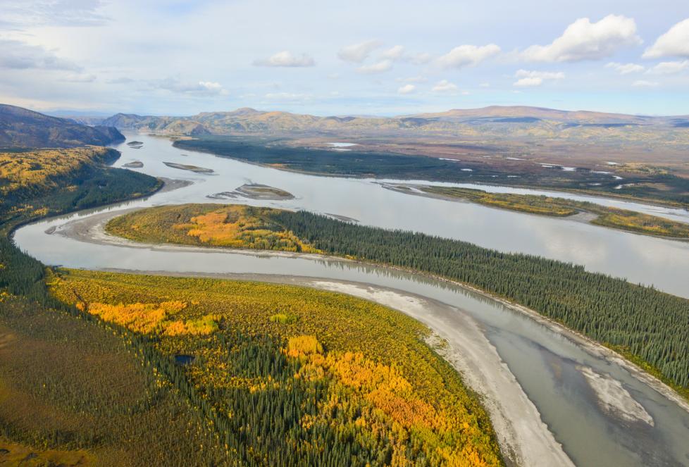 Aerial view of Yukon River and the surrounding landscape of forest and mountains