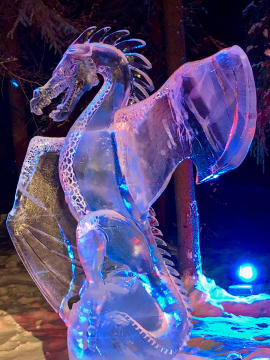 Large glowing dragon carved from clear ice