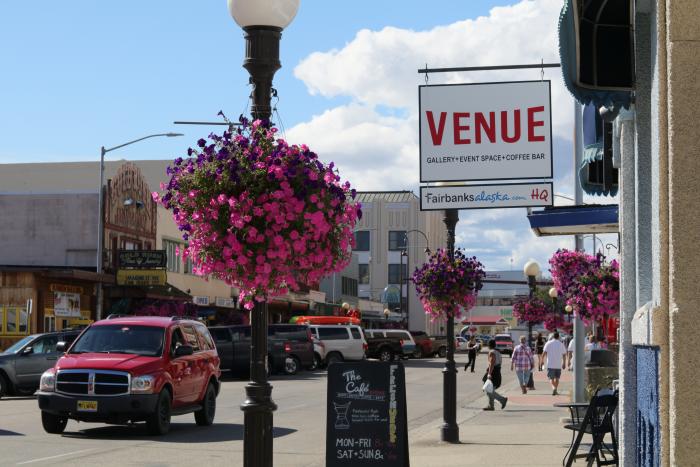 Brady Gross/Explore Fairbanks street scene in summer with hanging flower baskets along byway