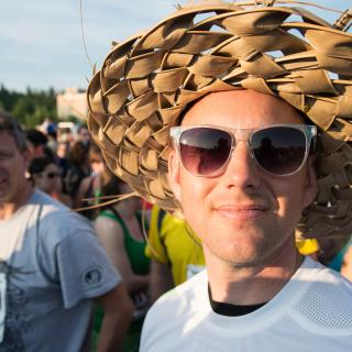 Portrait of person with sunglasses and hat at the Midnight Sun Run